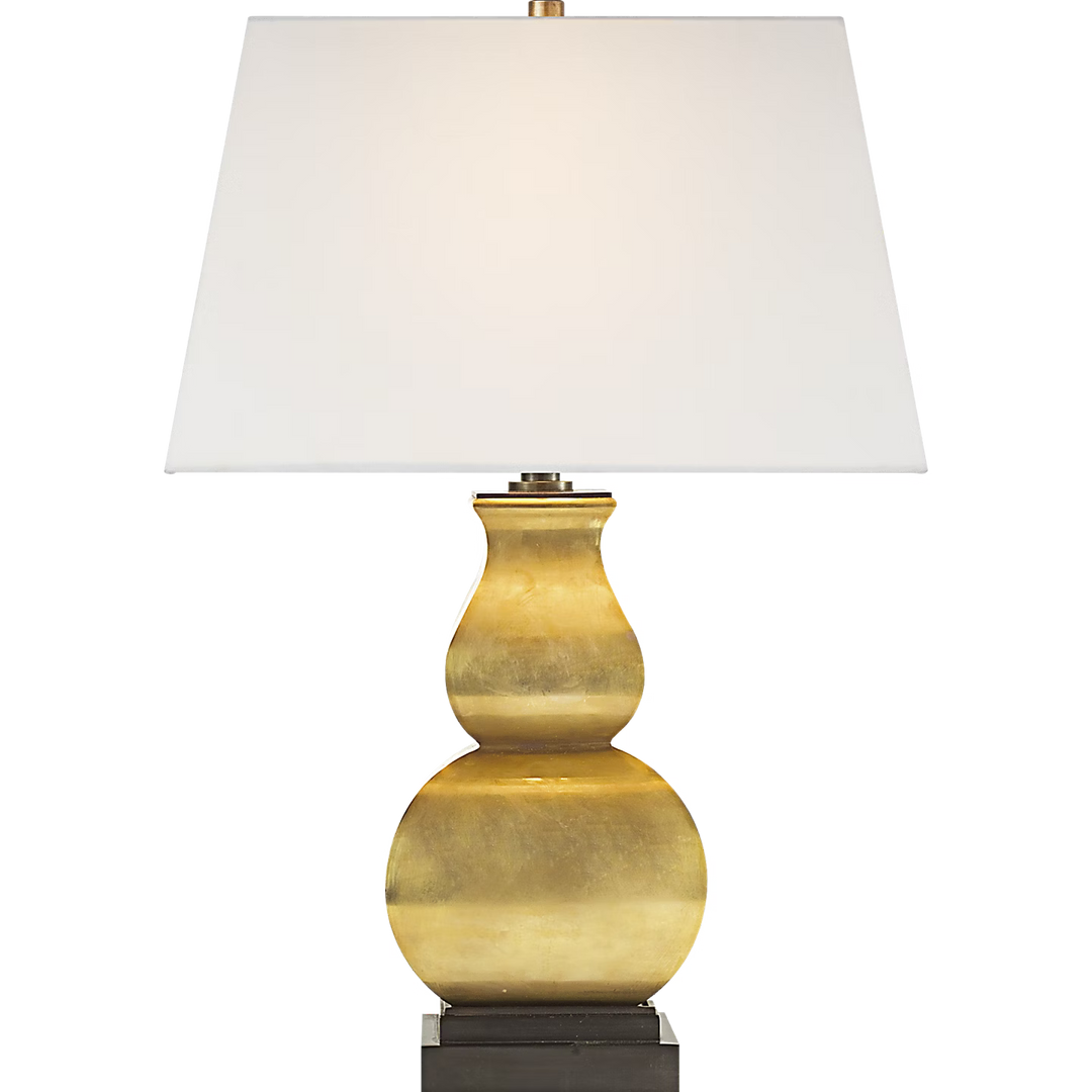 Decorative table lamp with a white shade on a clear background