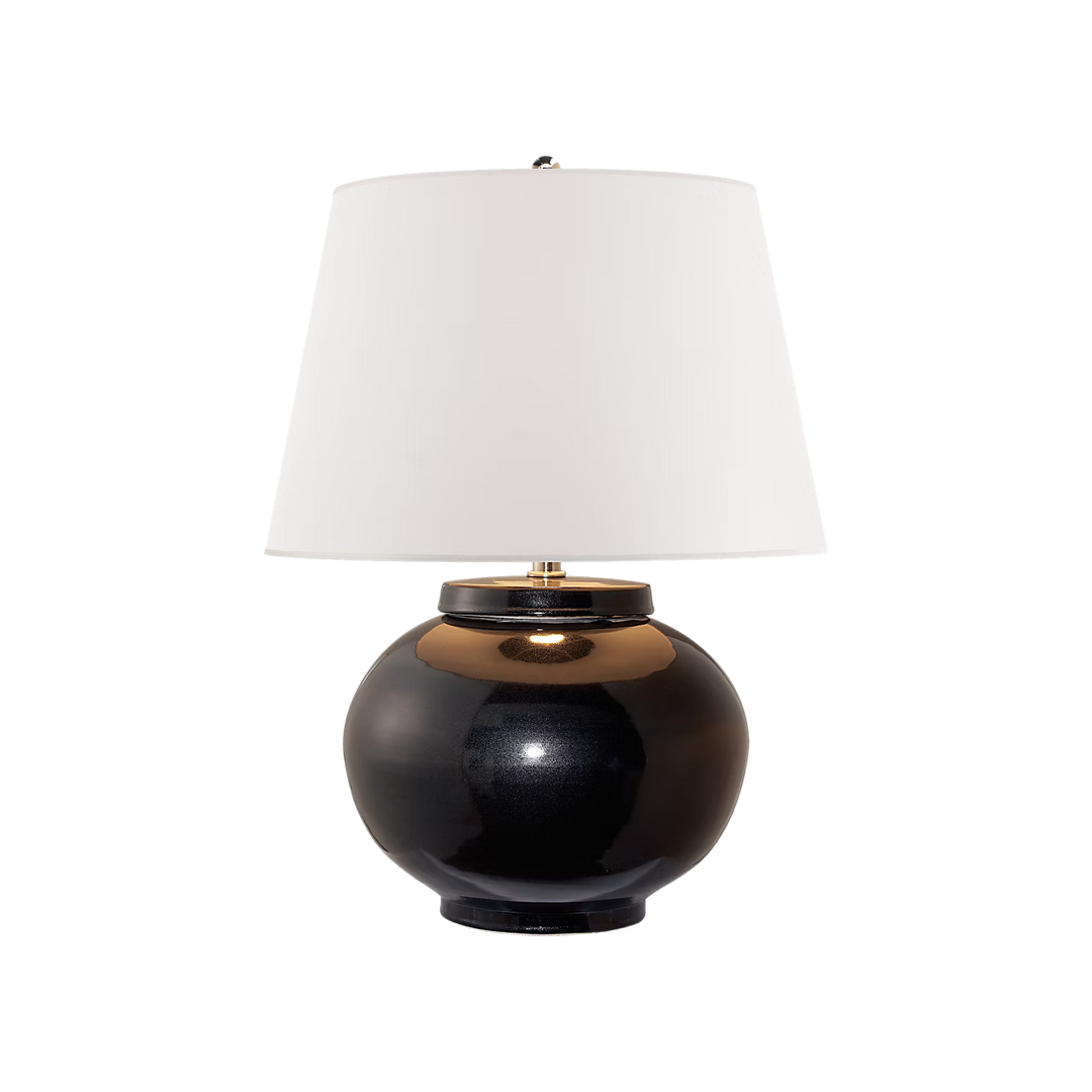 Table lamp with black base and white shade on a transparent background
